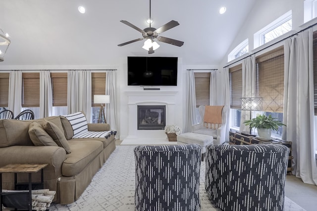 living room with lofted ceiling and ceiling fan