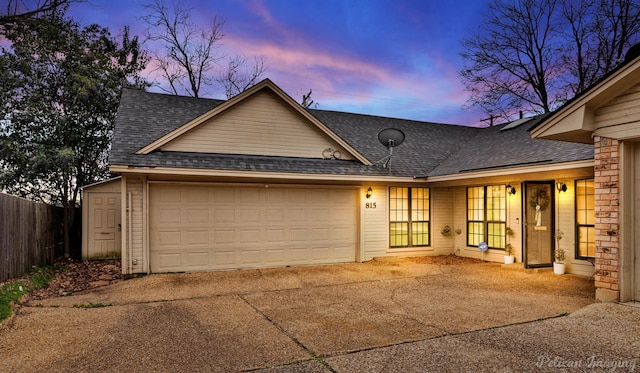 ranch-style house featuring a garage