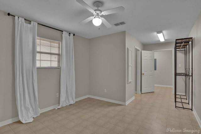 unfurnished room with ceiling fan