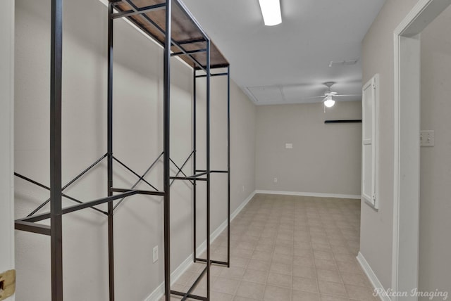 walk in closet featuring ceiling fan