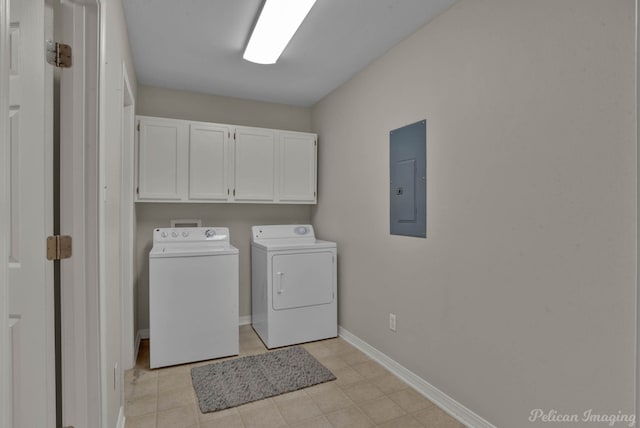 clothes washing area featuring independent washer and dryer, cabinets, and electric panel