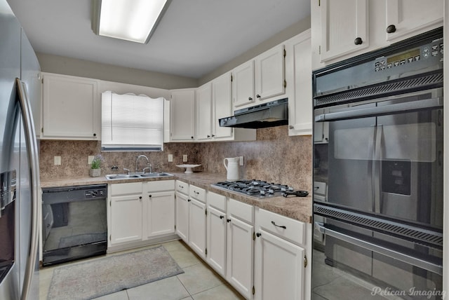 kitchen with tasteful backsplash, white cabinetry, sink, and black appliances