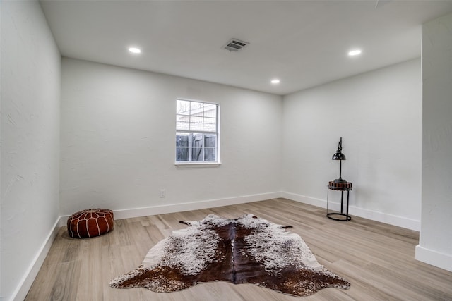 unfurnished room featuring hardwood / wood-style flooring