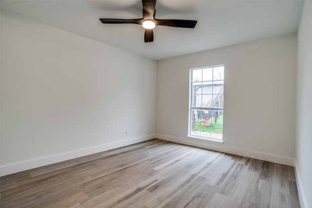 spare room featuring ceiling fan and light hardwood / wood-style floors