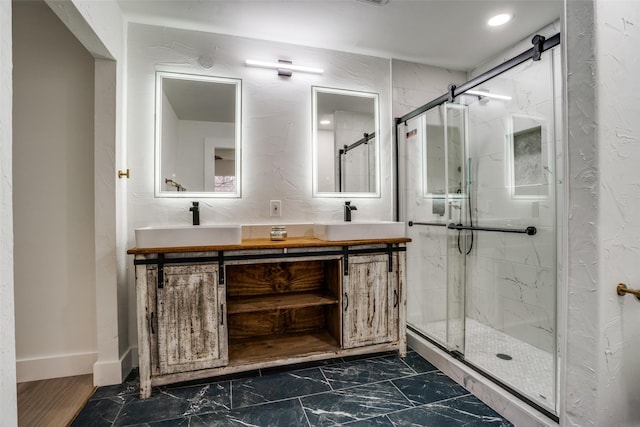 bathroom with walk in shower and vanity