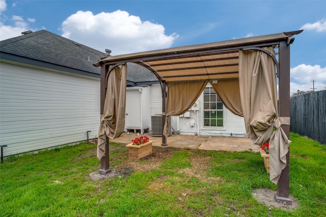 back of property featuring central AC, a patio, and a lawn