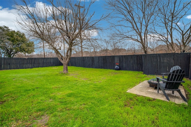 view of yard with a patio and an outdoor fire pit