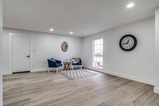 sitting room featuring light hardwood / wood-style floors