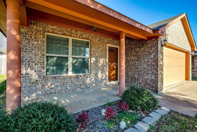 414 Tinker Trl, Burleson, TX 76028 - entrance to property featuring brick siding, an attached garage, and driveway