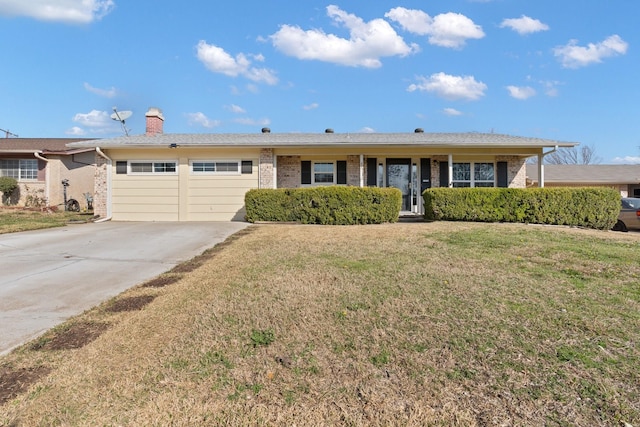 ranch-style house featuring a garage and a front yard