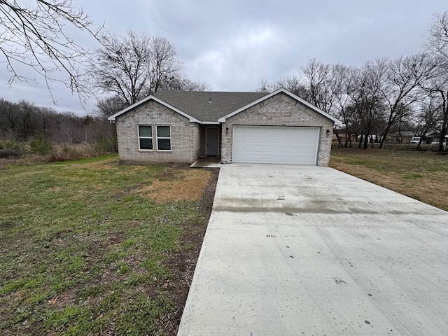 ranch-style house with a garage and a front yard