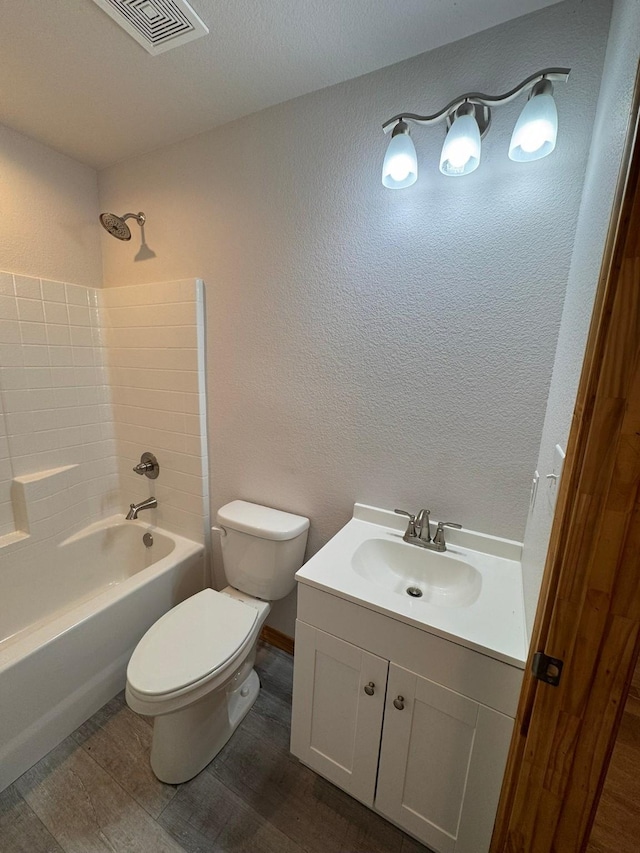 full bathroom with vanity, toilet, shower / bath combination, and wood-type flooring