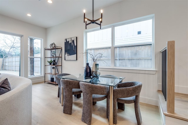 417 Wayne St, Dallas, TX 75223 - dining space featuring a chandelier, baseboards, light wood-style floors, and recessed lighting