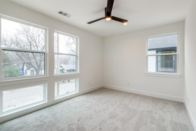 417 Wayne St, Dallas, TX 75223 - empty room featuring visible vents, ceiling fan, a wealth of natural light, and light colored carpet