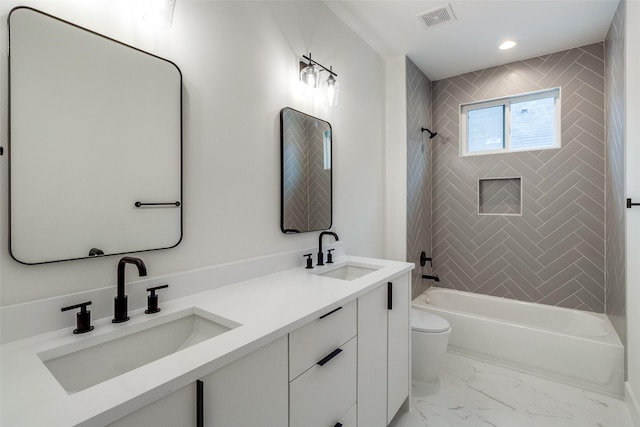 417 Wayne St, Dallas, TX 75223 - full bathroom featuring visible vents, marble finish floor, a sink, and toilet