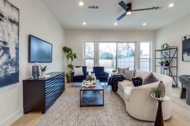 417 Wayne St, Dallas, TX 75223 - living room with visible vents, plenty of natural light, a ceiling fan, and light wood finished floors