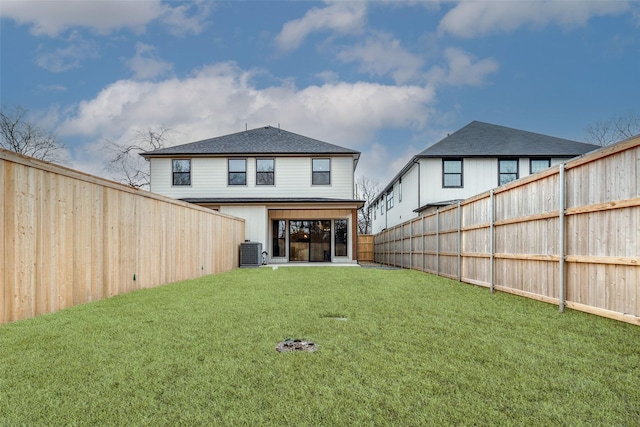 417 Wayne St, Dallas, TX 75223 - rear view of house with a yard, a fenced backyard, and central AC unit