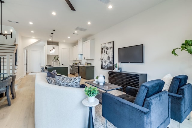 417 Wayne St, Dallas, TX 75223 - living area featuring recessed lighting, stairs, visible vents, and light wood-style floors