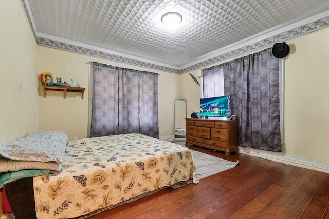 bedroom with hardwood / wood-style floors