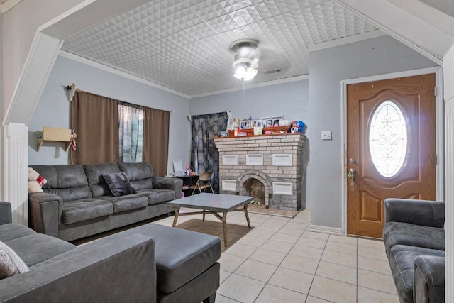 living room with light tile patterned floors and ornamental molding