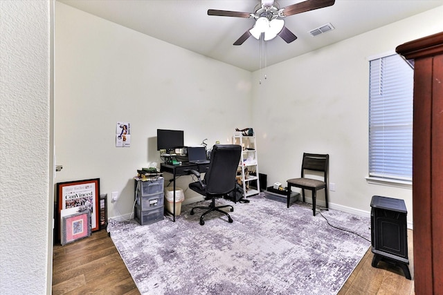 office space with ceiling fan and dark hardwood / wood-style flooring