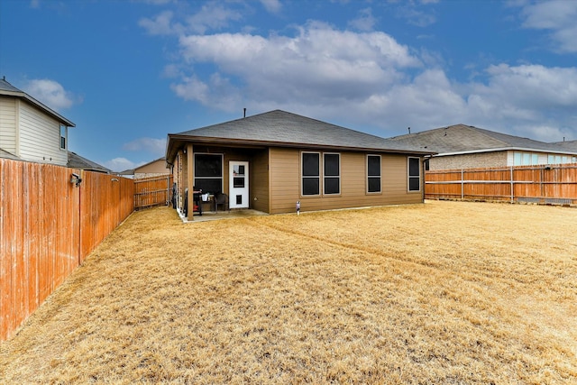 back of property with a patio