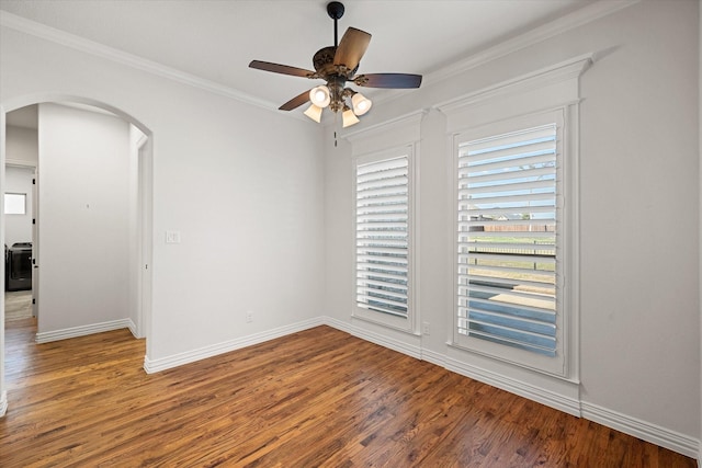 spare room with wood-type flooring, ornamental molding, and ceiling fan