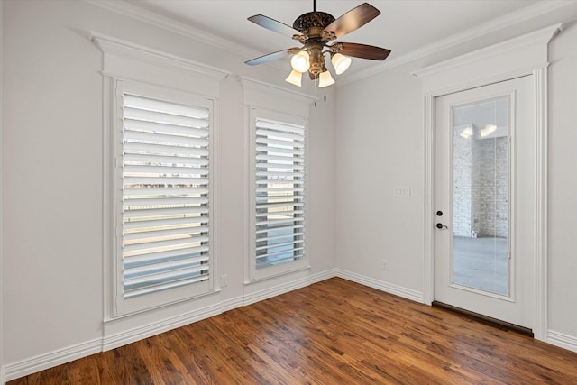 unfurnished room featuring hardwood / wood-style flooring, ornamental molding, and ceiling fan