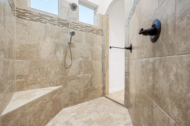 bathroom with a tile shower