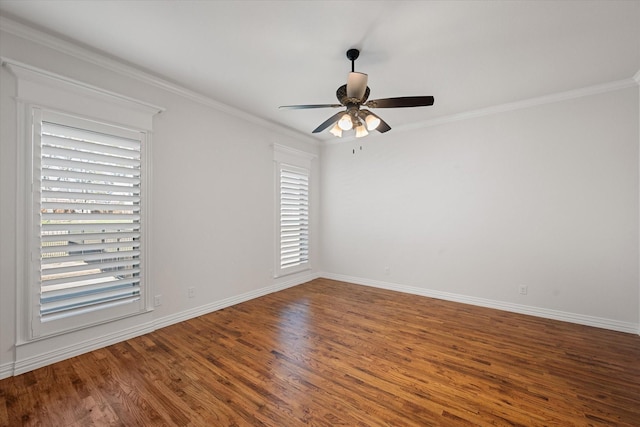 empty room featuring hardwood / wood-style floors, ornamental molding, and ceiling fan