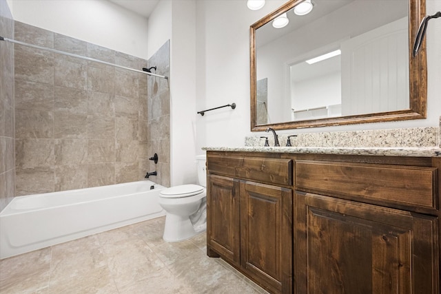 full bathroom featuring vanity, tiled shower / bath combo, tile patterned floors, and toilet