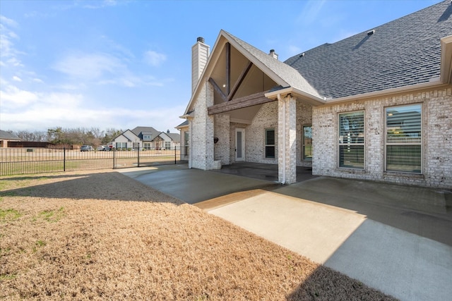 back of property with a patio