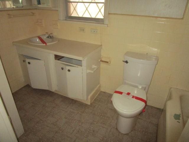 3359 Green Terrace Rd, Shreveport, LA 71118 - bathroom featuring vanity, tile walls, and toilet