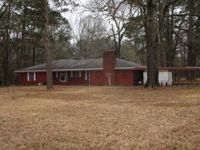 back of house with a yard