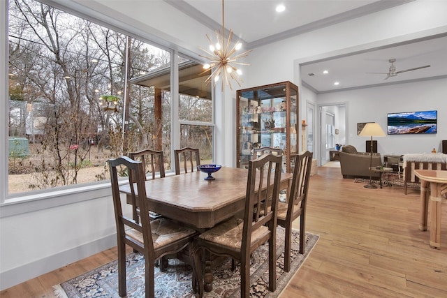 477 Lakepoint Loop, Pottsboro, TX 75076 - dining space with ceiling fan with notable chandelier, recessed lighting, baseboards, light wood-type flooring, and ornamental molding