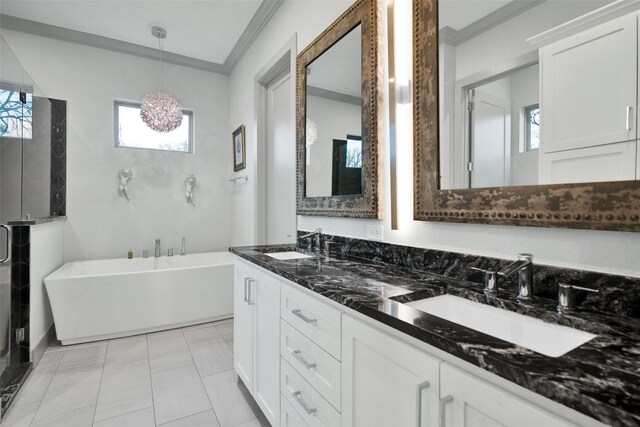 477 Lakepoint Loop, Pottsboro, TX 75076 - full bathroom featuring crown molding, double vanity, a freestanding bath, and a sink