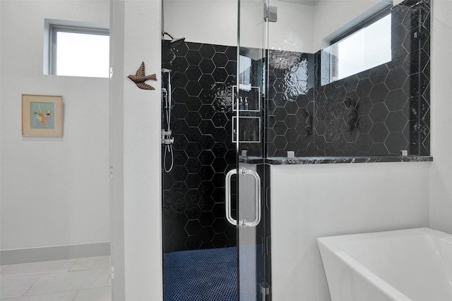 477 Lakepoint Loop, Pottsboro, TX 75076 - bathroom with plenty of natural light, tile patterned floors, a freestanding bath, and a shower stall