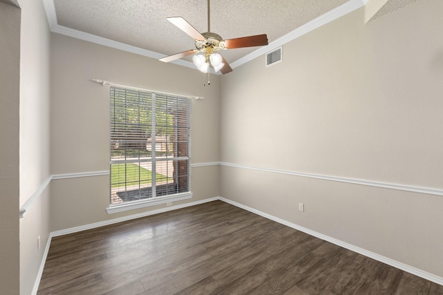 empty room featuring ceiling fan, a textured ceiling, visible vents, crown molding, and wood finished floors