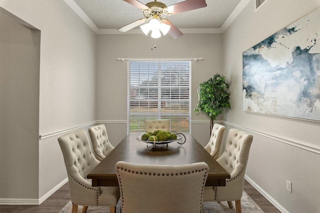 dining room featuring ceiling fan, ornamental molding, and wood finished floors