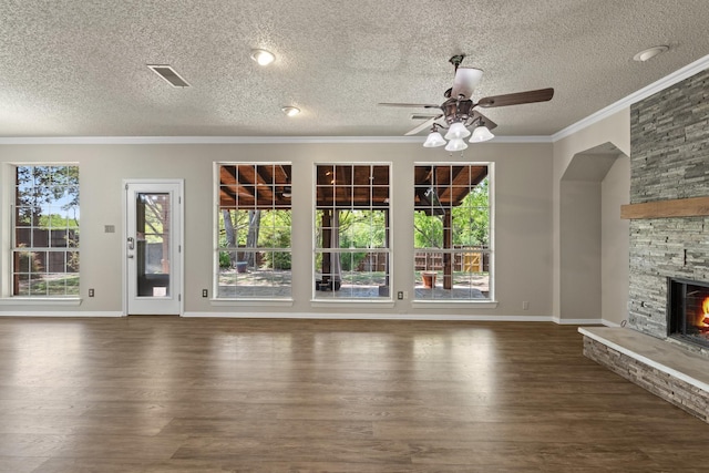 unfurnished living room featuring a ceiling fan, a textured ceiling, and wood finished floors