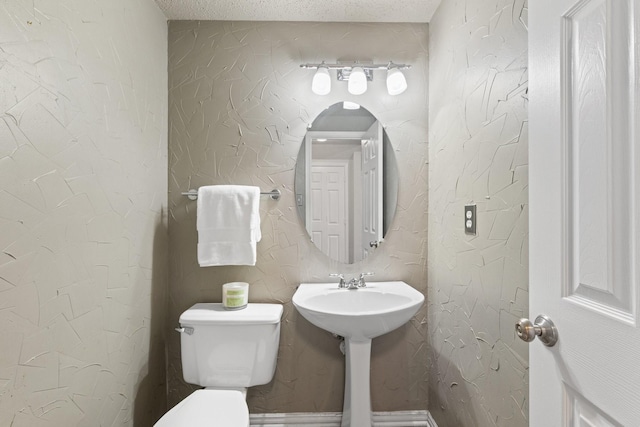 half bathroom featuring toilet