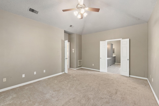 unfurnished bedroom with baseboards, light carpet, and visible vents