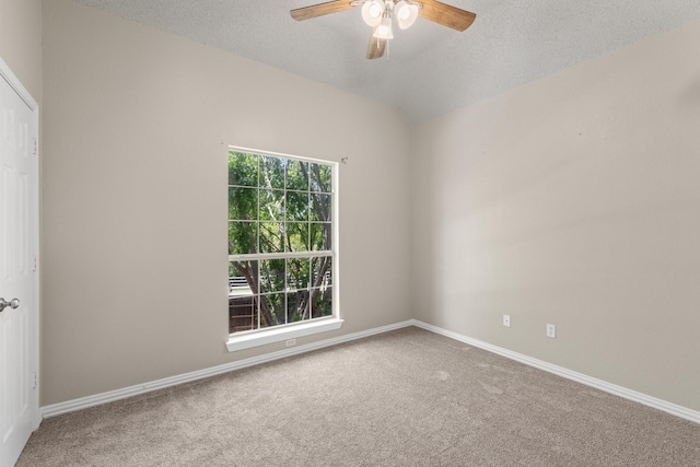 empty room with baseboards, a ceiling fan, and carpet