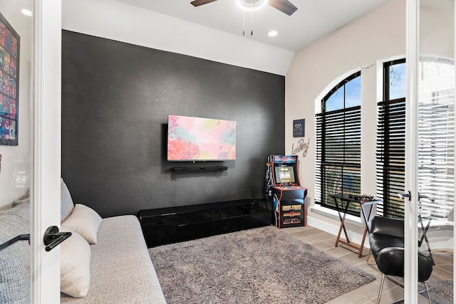 bedroom with vaulted ceiling, recessed lighting, baseboards, and wood tiled floor