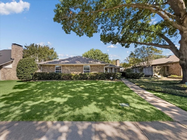 ranch-style house with a front yard