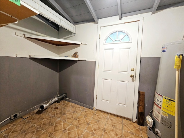 laundry area featuring gas water heater and hookup for an electric dryer