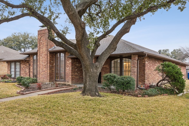 1943 Chesham Dr, Carrollton, TX 75007 - view of front of property with a front yard