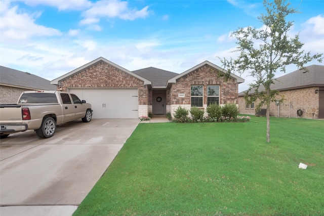 view of front facade with a garage and a front lawn