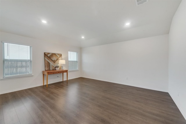 empty room featuring dark wood-type flooring