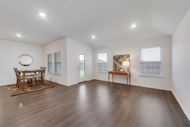 entrance foyer featuring dark hardwood / wood-style flooring and vaulted ceiling